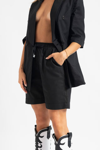 Double-breasted jacket and shorts suit in black linen