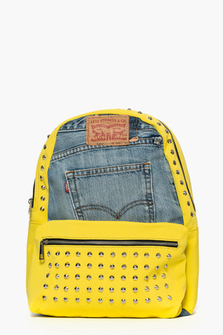 Backpack in jeans and yellow lycra fabric with studs